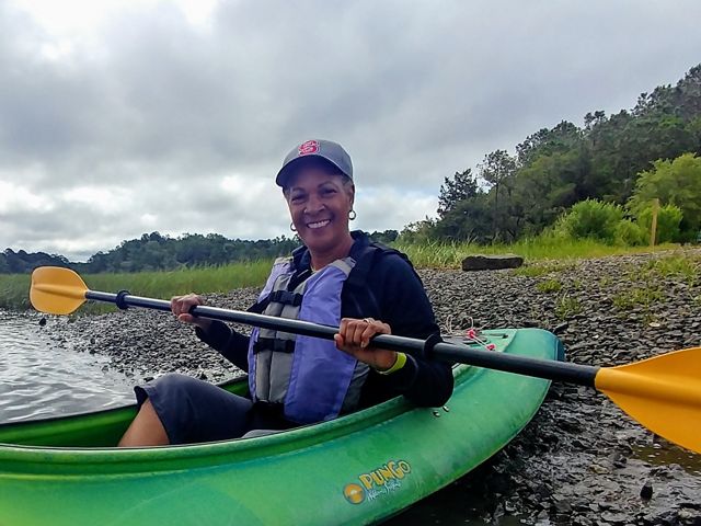 Dale Threatt-Taylor, State Director of TNC in South Carolina, in a kayak on the Wando River while preparing for a donor kayaking event.